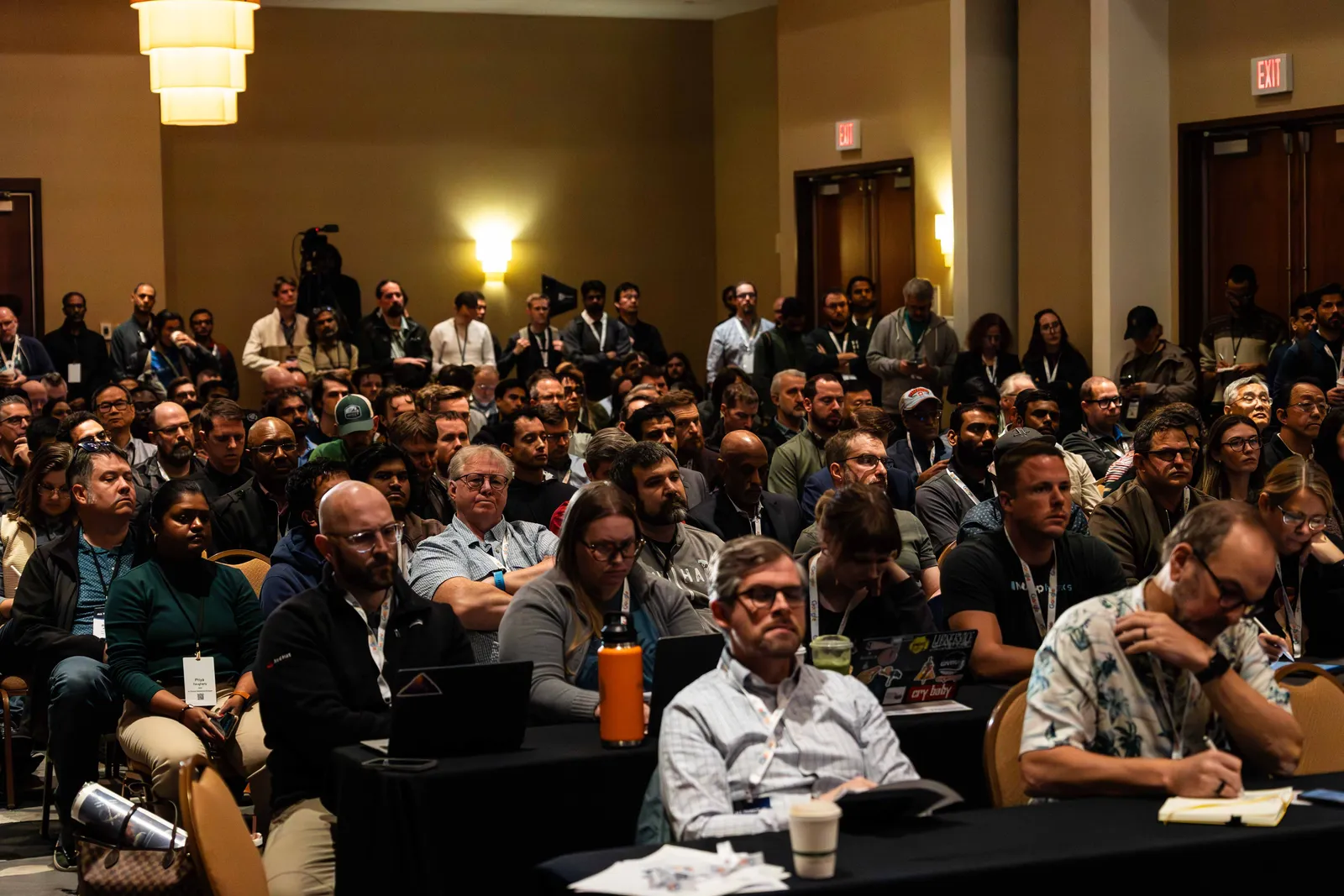 A packed workshop room of business professionals at All Things AI 2026